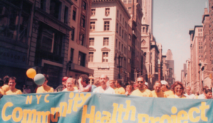 Members of the Callen-Lorde community, then known as Community Health Project, marching at a 1980s Pride parade.